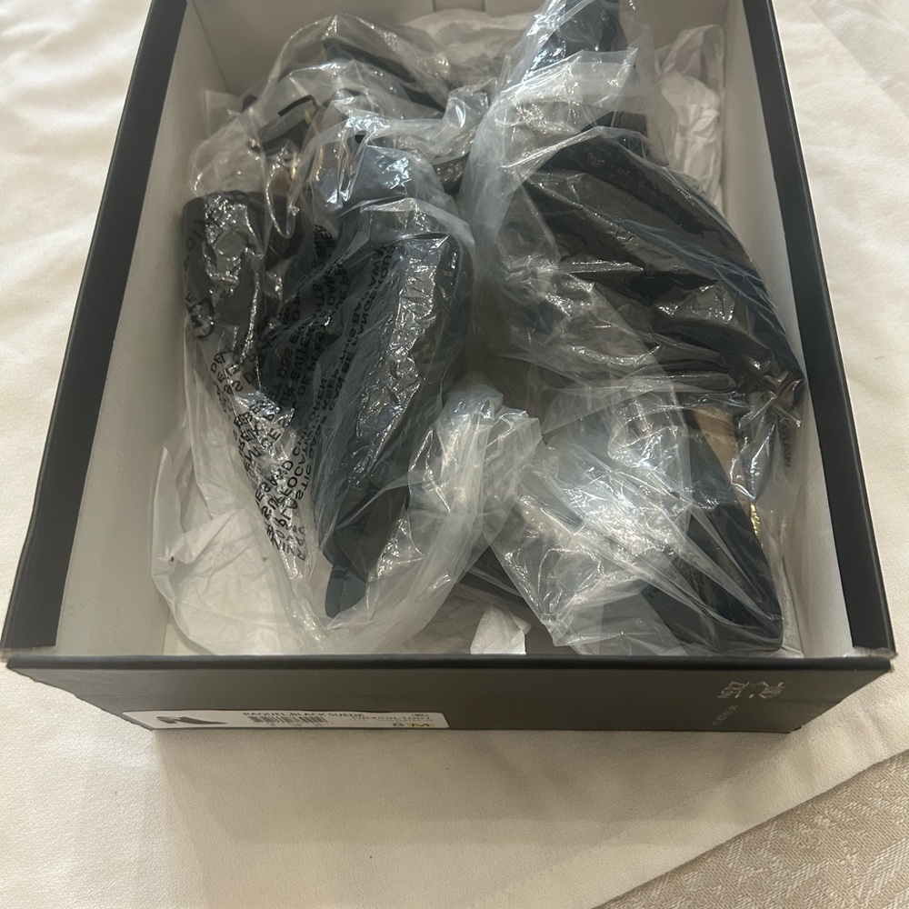 Gently used black Swede heels by naturalizes.